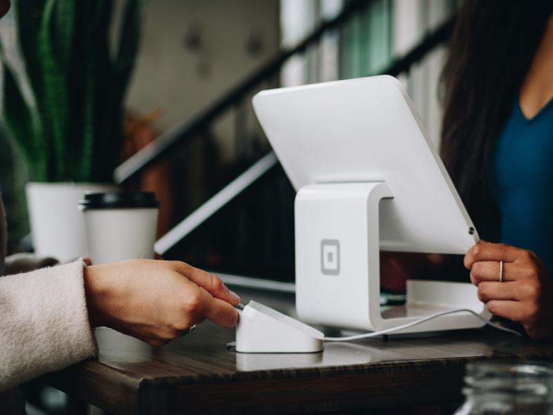Professional confidently presenting pricing in a client meeting